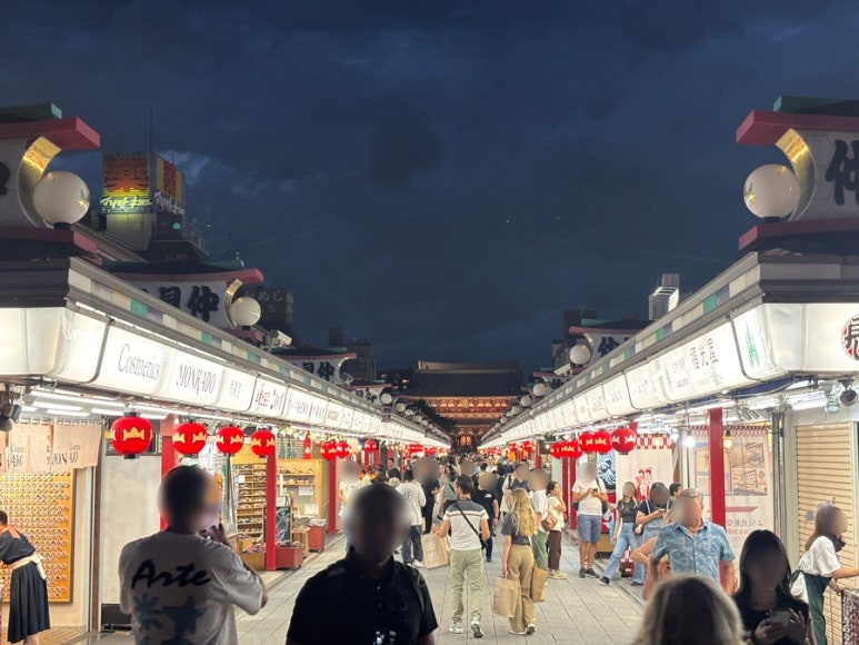 Bustling Nakamise Shopping Street in Asakusa with traditional souvenir shops and food stalls