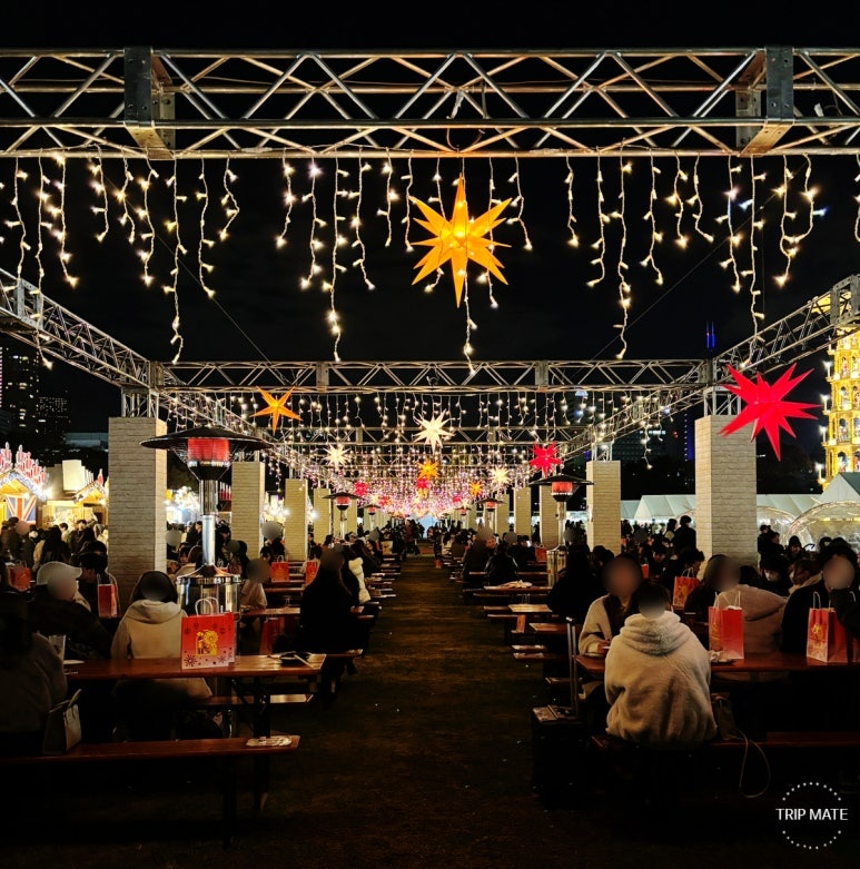 People enjoying food at 2025 Meiji Jingu Gaien Christmas Market