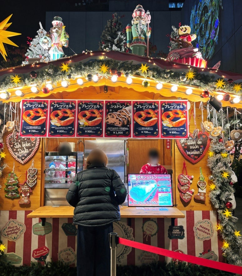 4-meter giant stollen being sliced and sold at Tokyo Skytree Christmas Market 2025