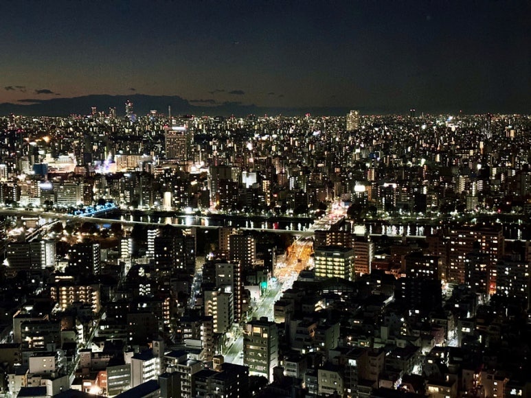 Inside Tokyo Skytree observation deck with night view through windows