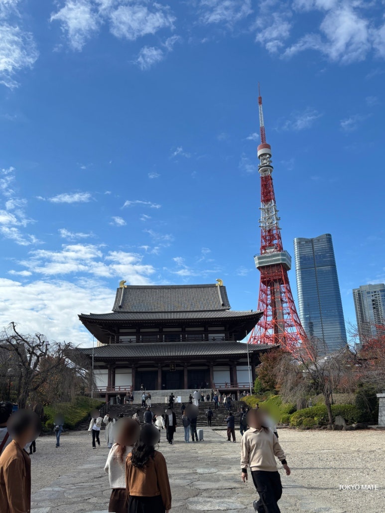 Zojoji Temple main hall with Tokyo Tower rising behind it