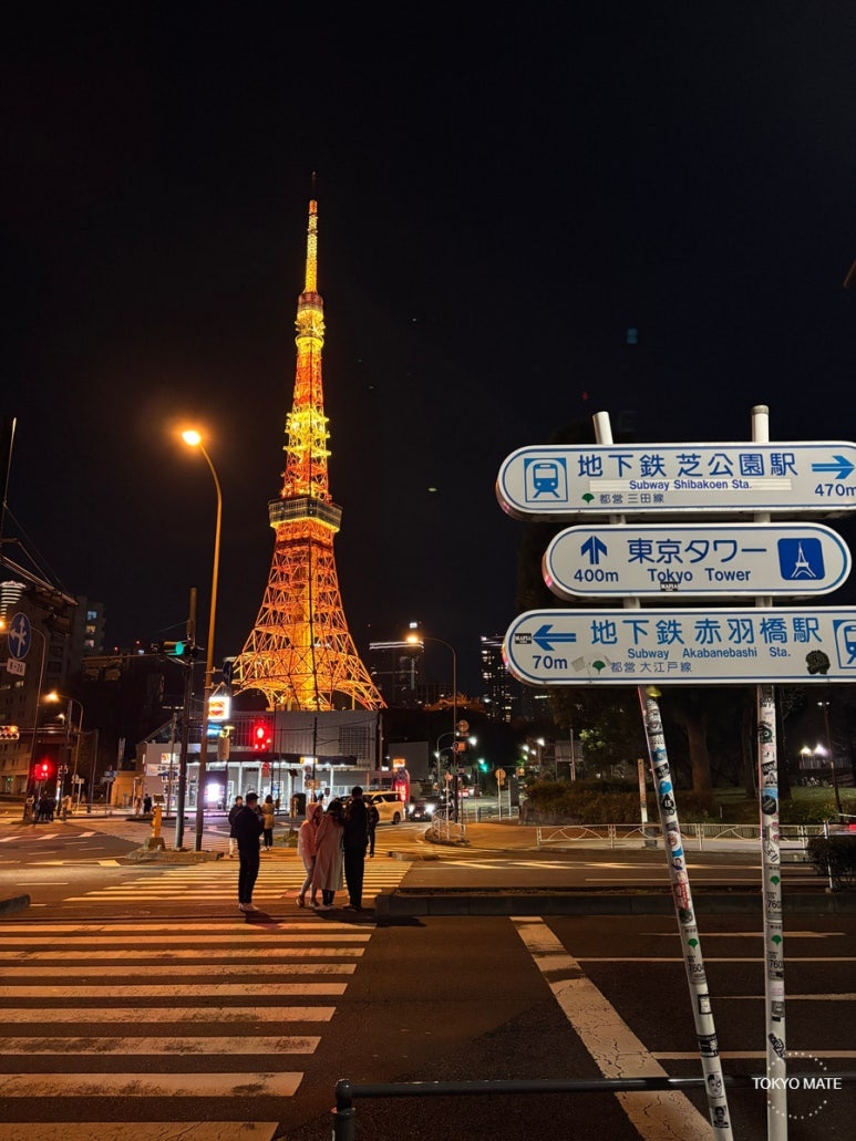Akabanebashi Station crosswalk at night with illuminated Tokyo Tower
